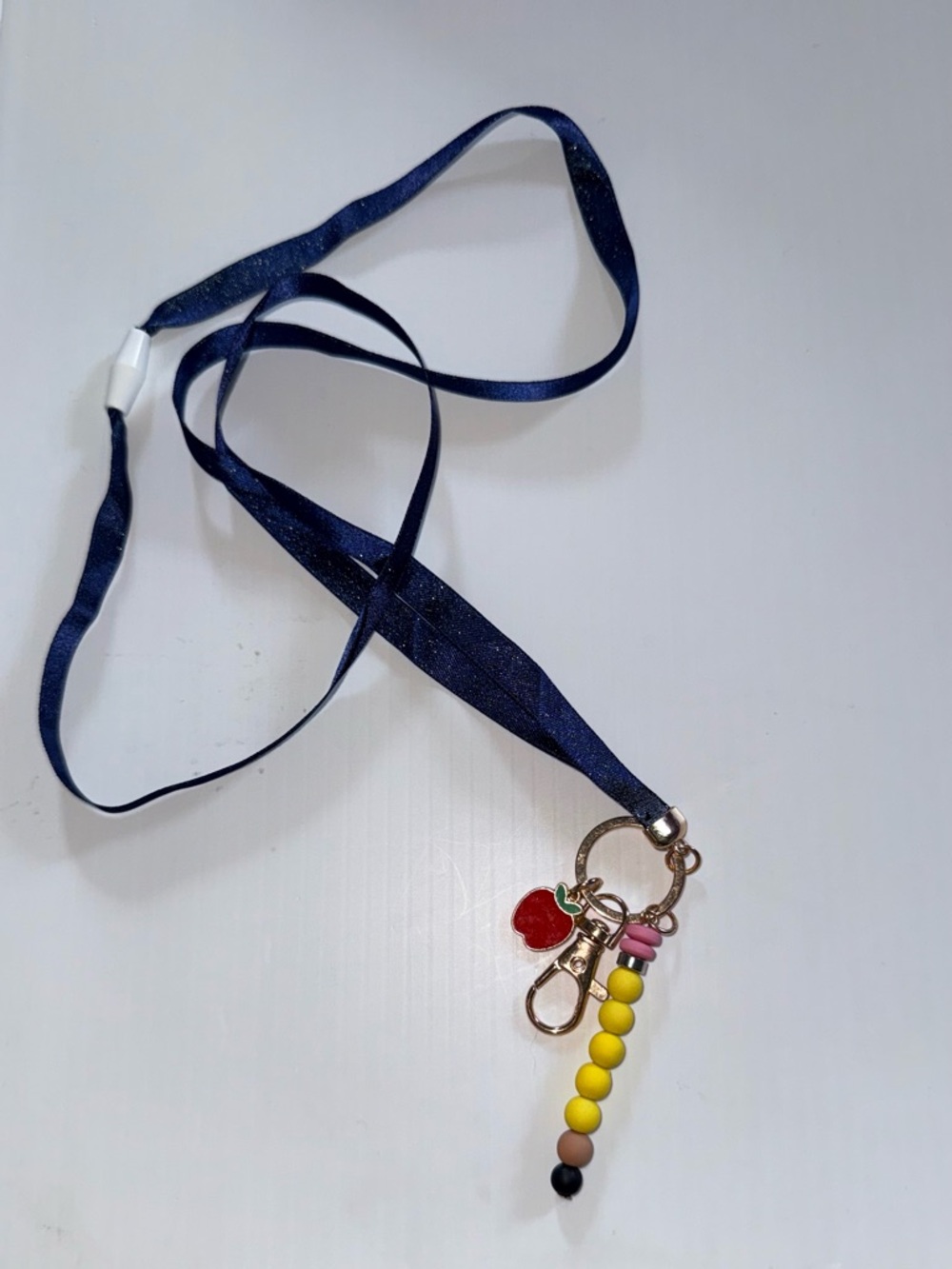 Spritz Navy Lanyard with Yellow Bead Tassel and Red Apple Charm